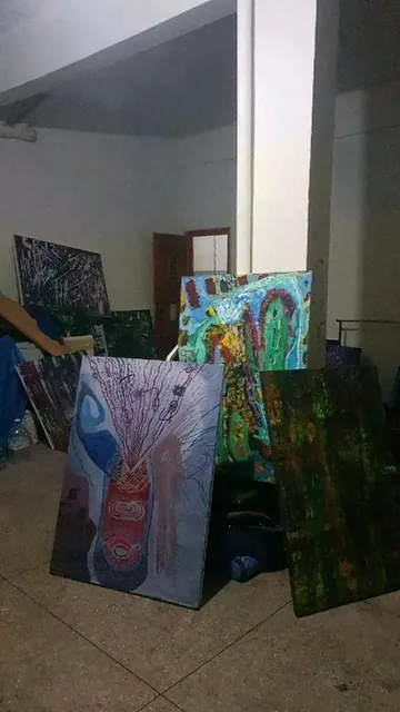 Canvases stacked against the studio wall